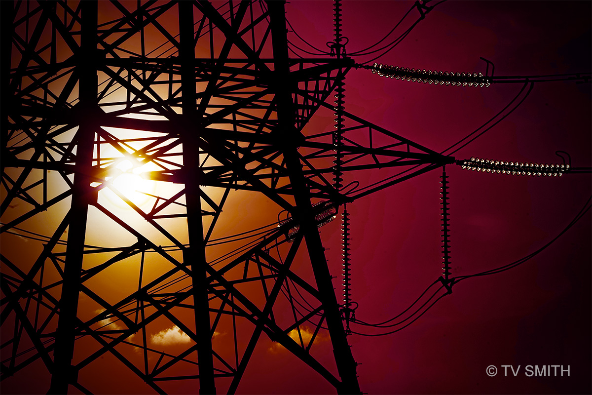The Magnetic Draw Of Electricity Pylons, Cables And Sunset